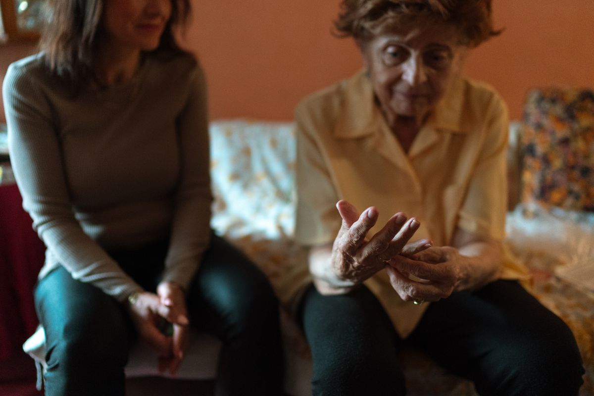 Comforting hands representing hospice support